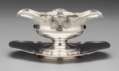 Appraisal: French silver sauceboat oval with foliate handle reeded border attached