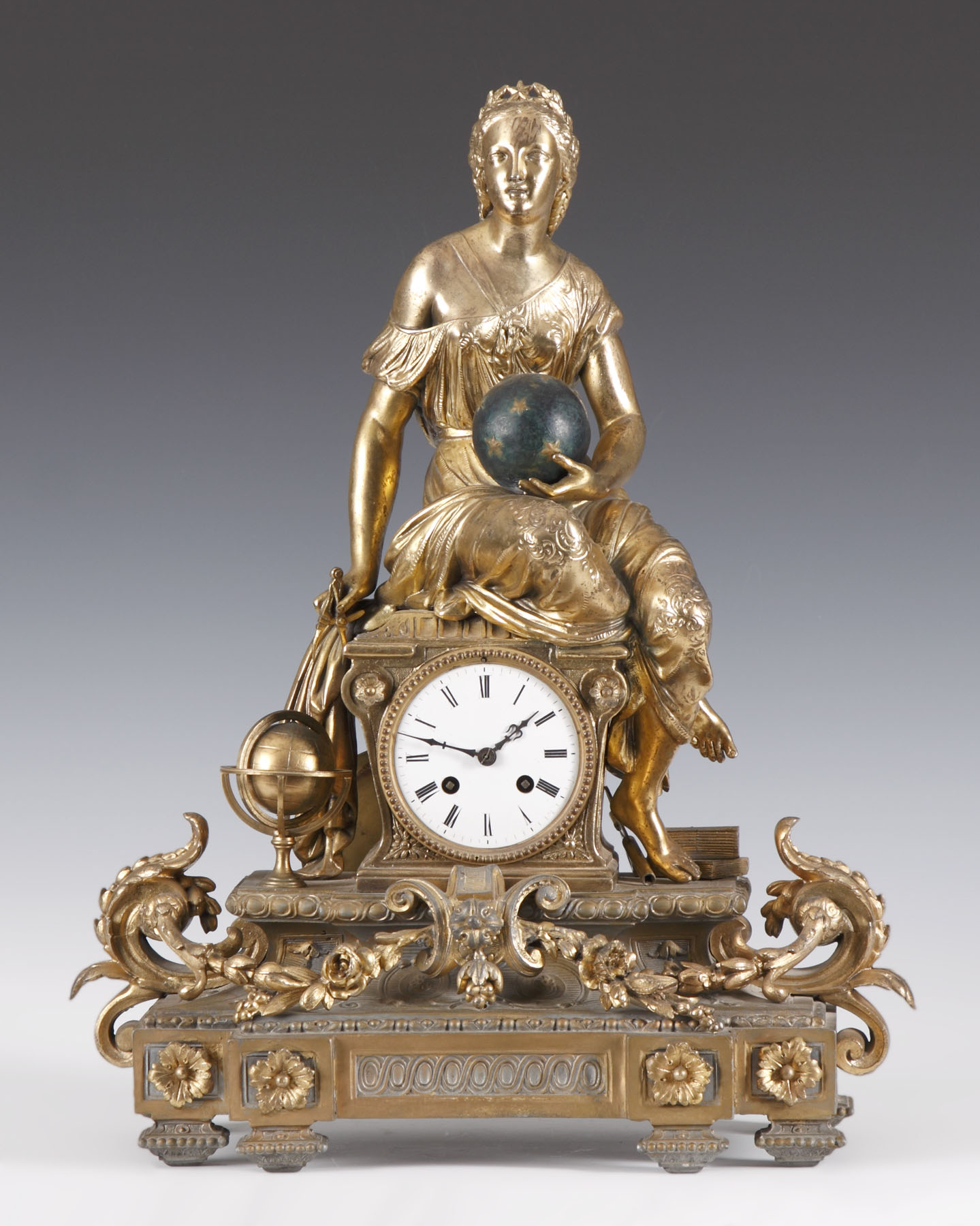 Appraisal: French Gold Patinated Metal Clock Depicting seated lady with spheres