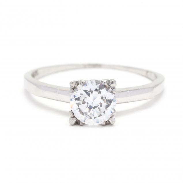 Appraisal: PLATINUM AND DIAMOND RING Centered on a prong set transitional