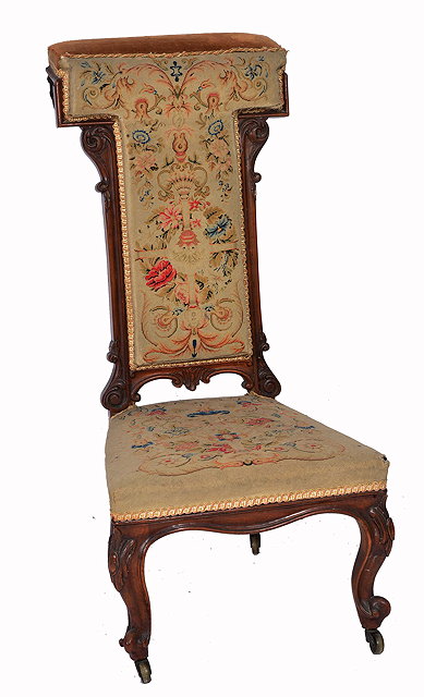 Appraisal: A VICTORIAN ROSEWOOD PRIE DIEU CHAIR with high back cabriole