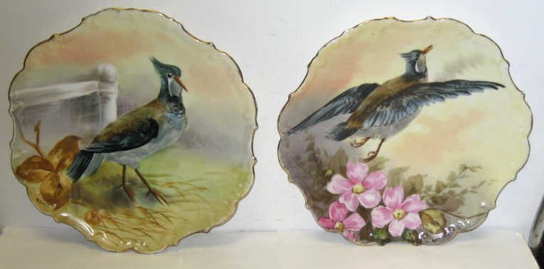 Appraisal: FLAMBEAU CHINA LIMOGES FRANCE Pair of porcelain display bird plates