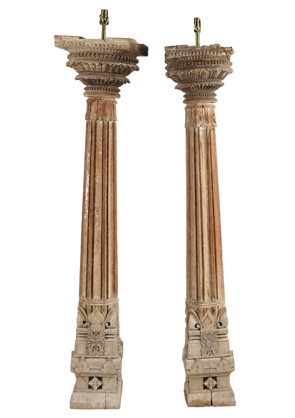 Appraisal: PAIR OF CARVED WOOD COLUMNSelectrified as lamps Condition evidence of