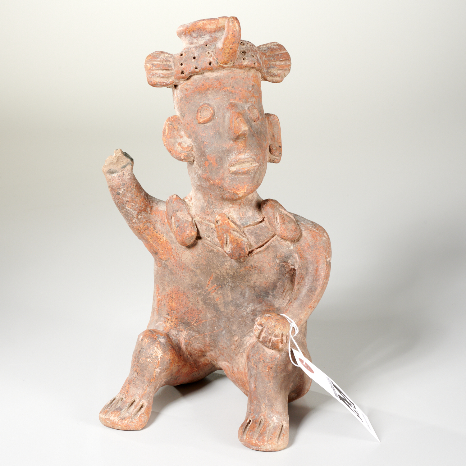 Appraisal: PRE COLUMBIAN STYLE SEATED EARTHENWARE FIGURE Poss Jalisco earthenware pottery