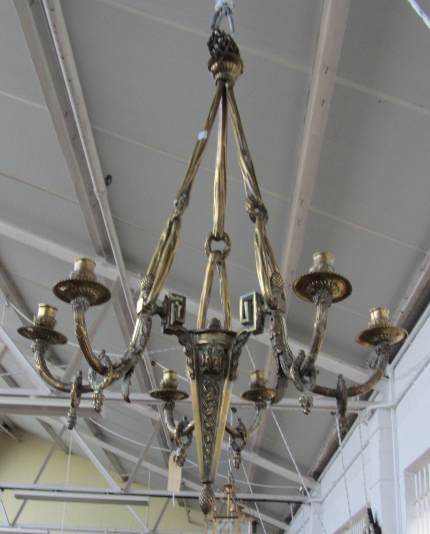 Appraisal: A continental brass six light chandelier moulded and cast with