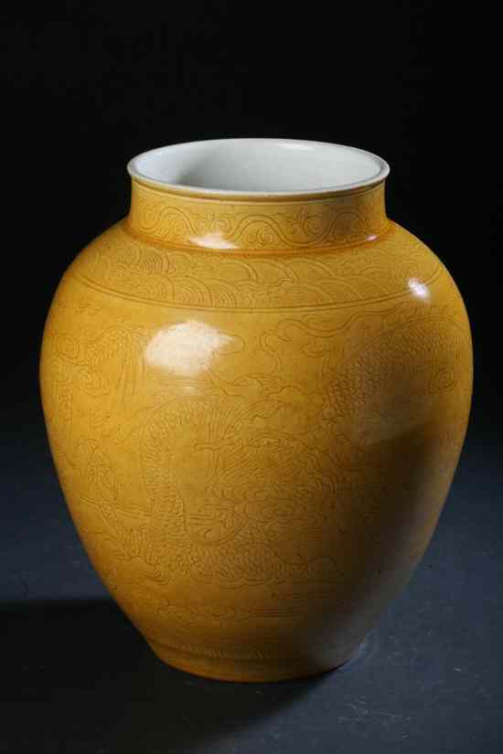 Appraisal: CHINESE MONOCHROME YELLOW PORCELAIN VASE Qianlong incised seal mark Incised