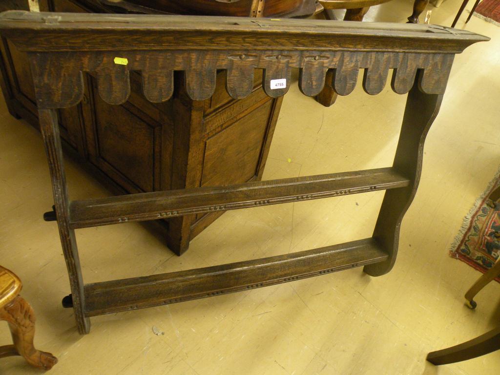 Appraisal: A two tier oak delft rack with a shaped apron