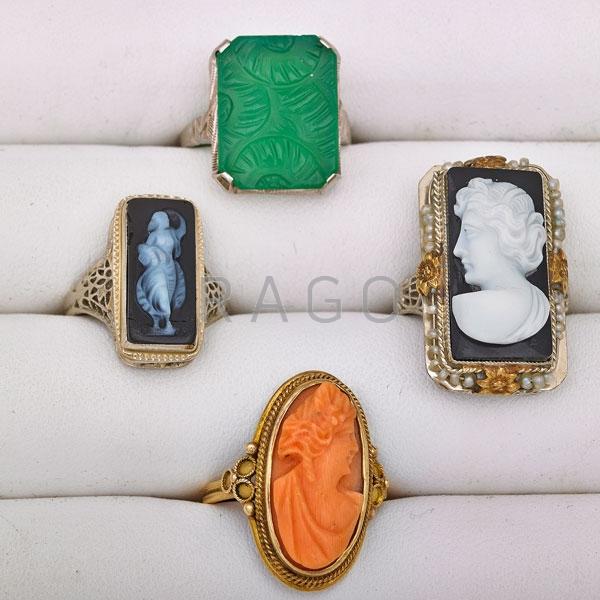 Appraisal: FOUR ART DECO CARVED HARDSTONE K GOLD RINGS Condition Report