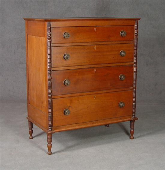 Appraisal: Walnut Four-Drawer Chest of Drawers Circa Paneled ends with turned