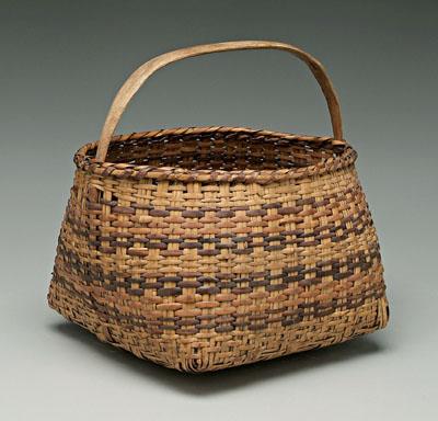 Appraisal: Cherokee river cane basket faded brown and orange weavers notched