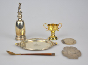 Appraisal: A miniature silver golf trophy a miniature silver gilt trophy