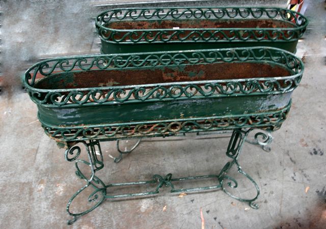 Appraisal: A pair of late th century French green painted iron