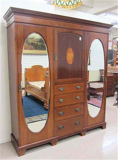 Appraisal: AN EDWARDIAN INLAID MAHOGANY WARDROBE English c in three vertical