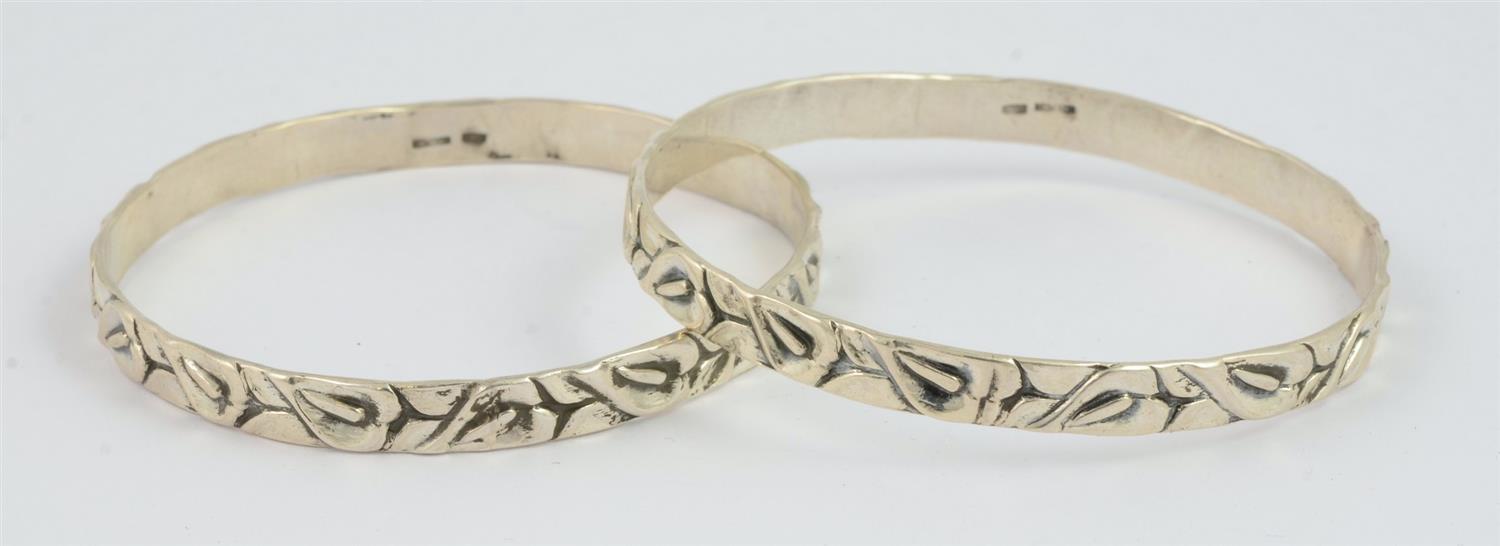 Appraisal: Pair of Sterling Silver Wedding Bangles by Cini - diameter