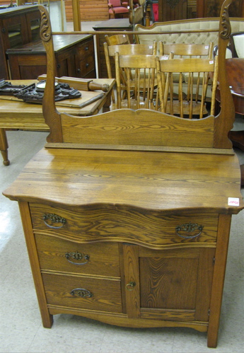 Appraisal: LATE VICTORIAN ASHWOOD WASHSTAND American late th century the front