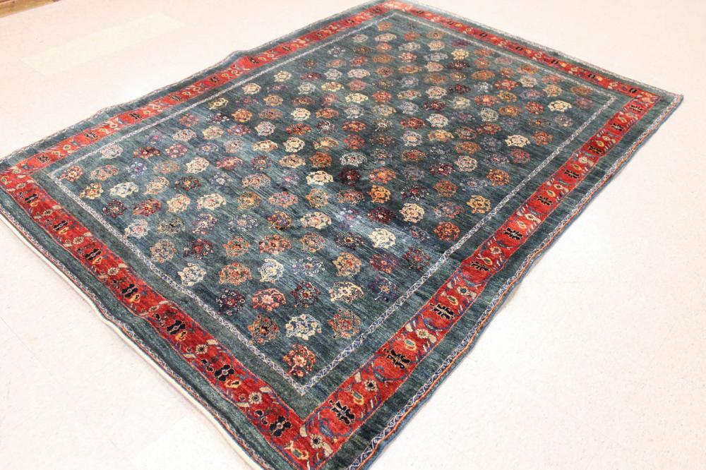 Appraisal: HAND KNOTTED ORIENTAL CARPET repeating rows of stylized flower heads