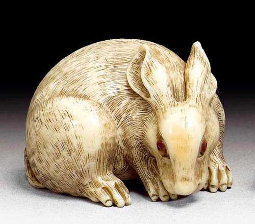 Appraisal: NETSUKE Japan th century L cm Ivory Hare with engraved