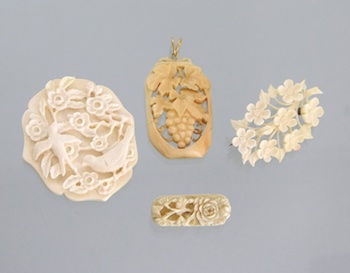 Appraisal: A Group of Four Carved Ivory Brooches and Ornaments Perfect