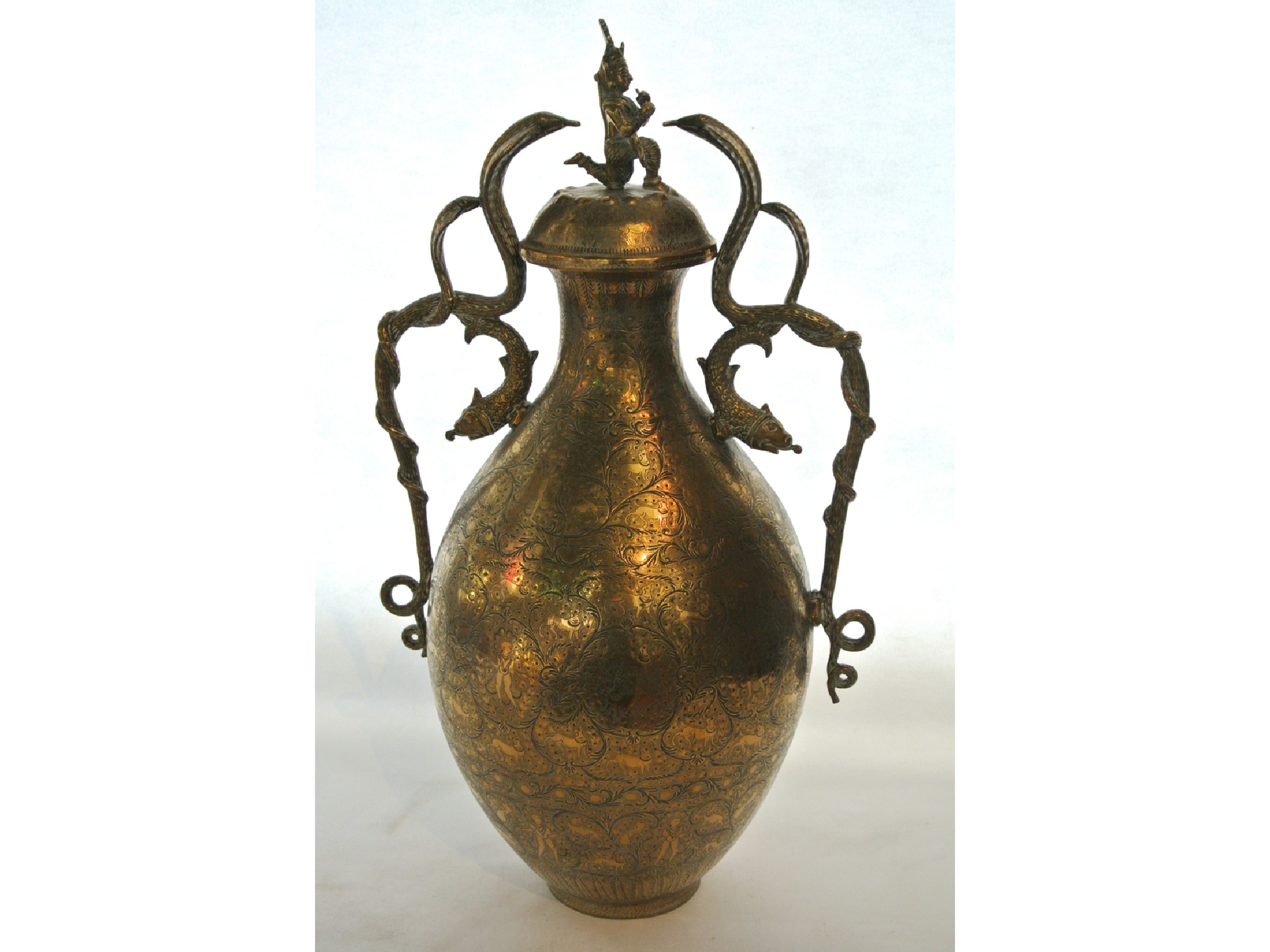 Appraisal: A large Indian brass vase and cover with profusely engraved