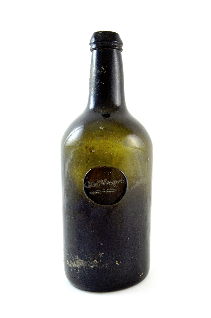 Appraisal: A green glass bottle th th century labelled 'Geoe Vosper'