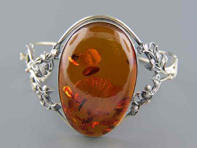 Appraisal: Amber Sterling Bracelet oval golden amber with insects wings debris