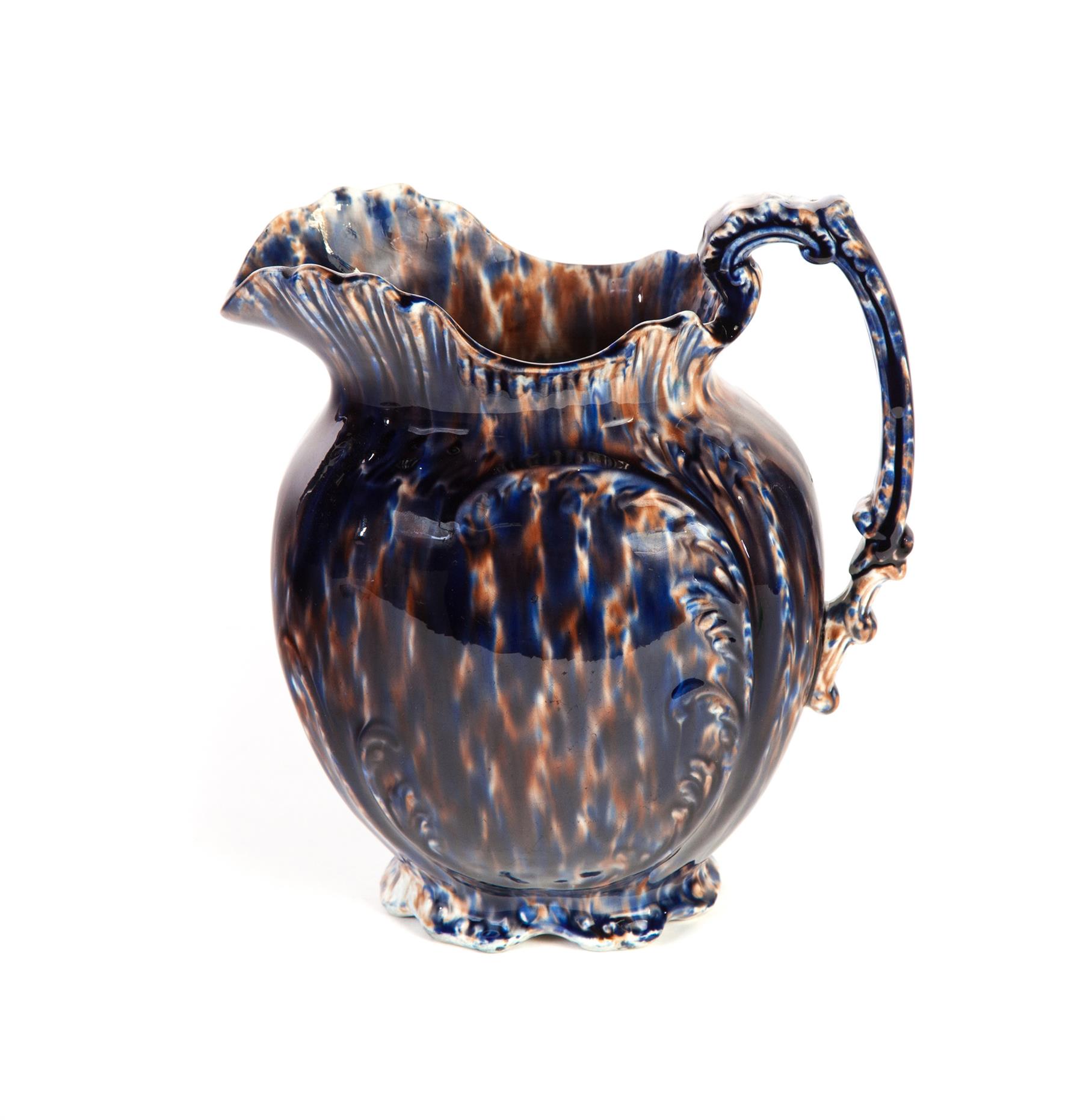 Appraisal: MOLDED PITCHER WITH BLUE AND BROWN SPONGING American th century