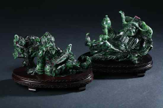 Appraisal: TWO CHINESE ZEOLITE FIGURES OF IMMORTALS Each seated at ease