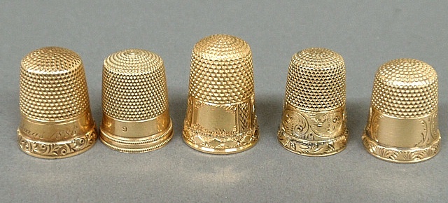 Appraisal: - Five tested k gold thimbles dwt -