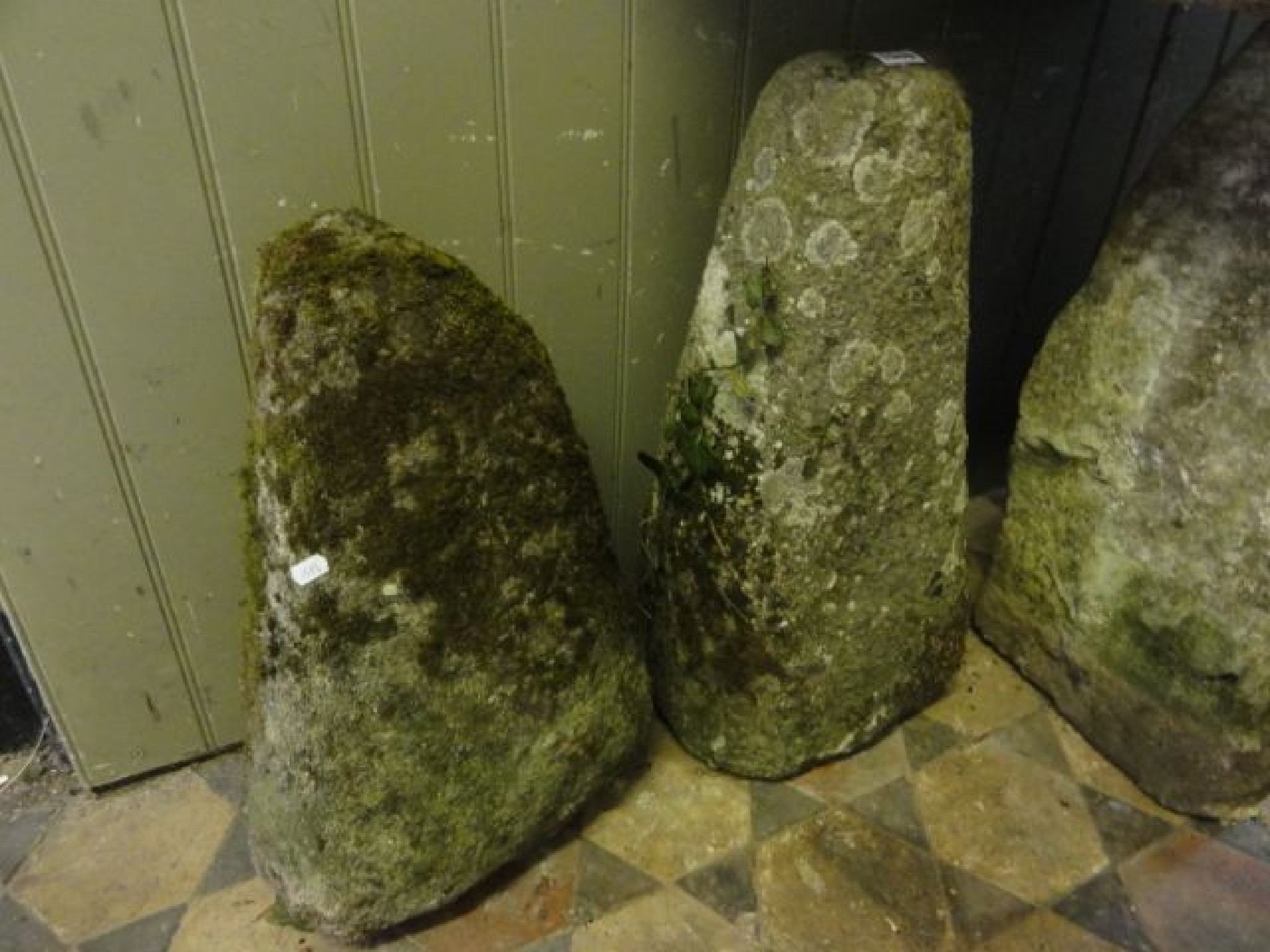 Appraisal: Two similar weathered granite stone agricultural posts of tapered form