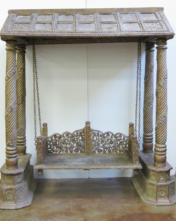 Appraisal: A Thai carved giltwood Love Seat with arched canopy above