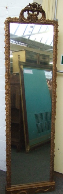 Appraisal: A th century giltwood tall pier glass with scroll surmount