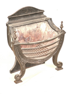 Appraisal: A cast iron fire basket early th century the raised