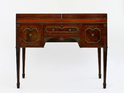 Appraisal: A George III mahogany dressing table with double folding top