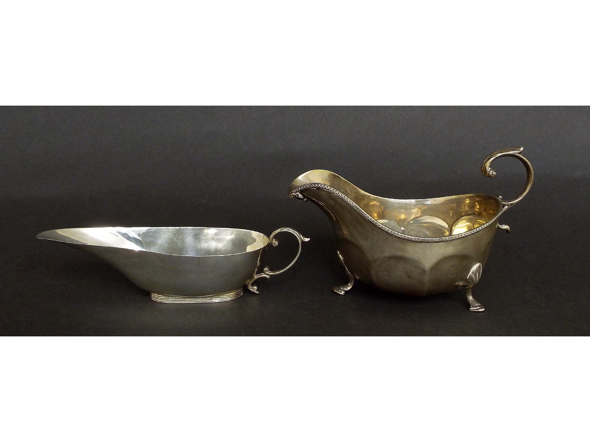 Appraisal: Georgian style silver sauceboat of small proportions maker Adie Brothers