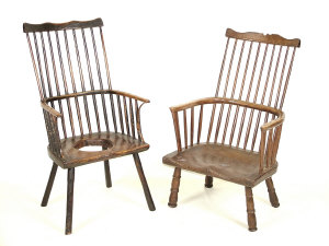 Appraisal: A George III style beech and oak comb back armchair