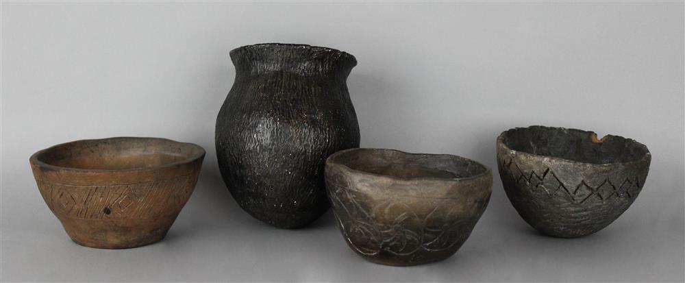 Appraisal: THREE PAMUNKEY PRIMITIVE STYLE POTTERY BOWLS AND A GLOBULAR JAR