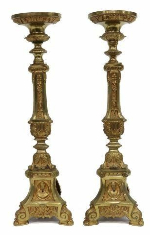 Appraisal: pair Continental gilt metal altar candlesticks neoclassical style standard rising