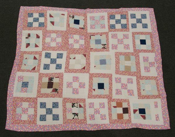 Appraisal: Cotton nine patch quilt hand sewn body machined edge vibrant