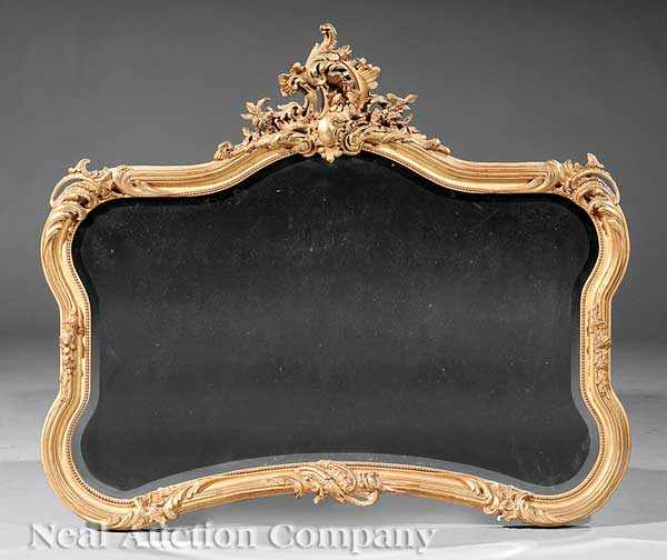 Appraisal: An American Rococo Revival Giltwood Mirror late th c shaped