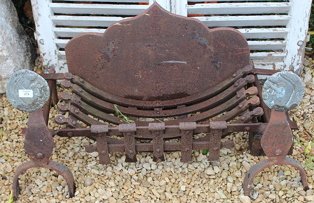 Appraisal: AN OLD CAST AND WROUGHT IRON FIRE BASKET the shaped