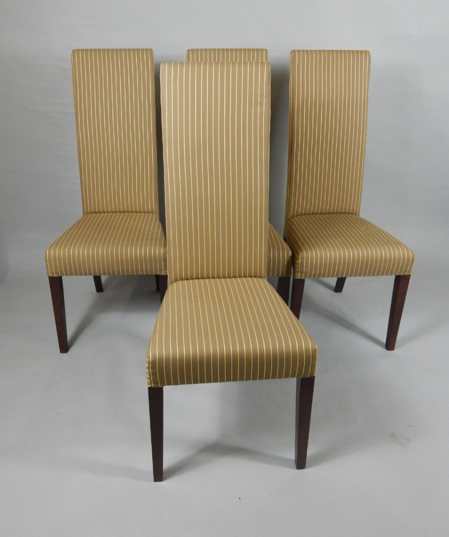 Appraisal: A set of four mahogany single dining chairs with overstuffed