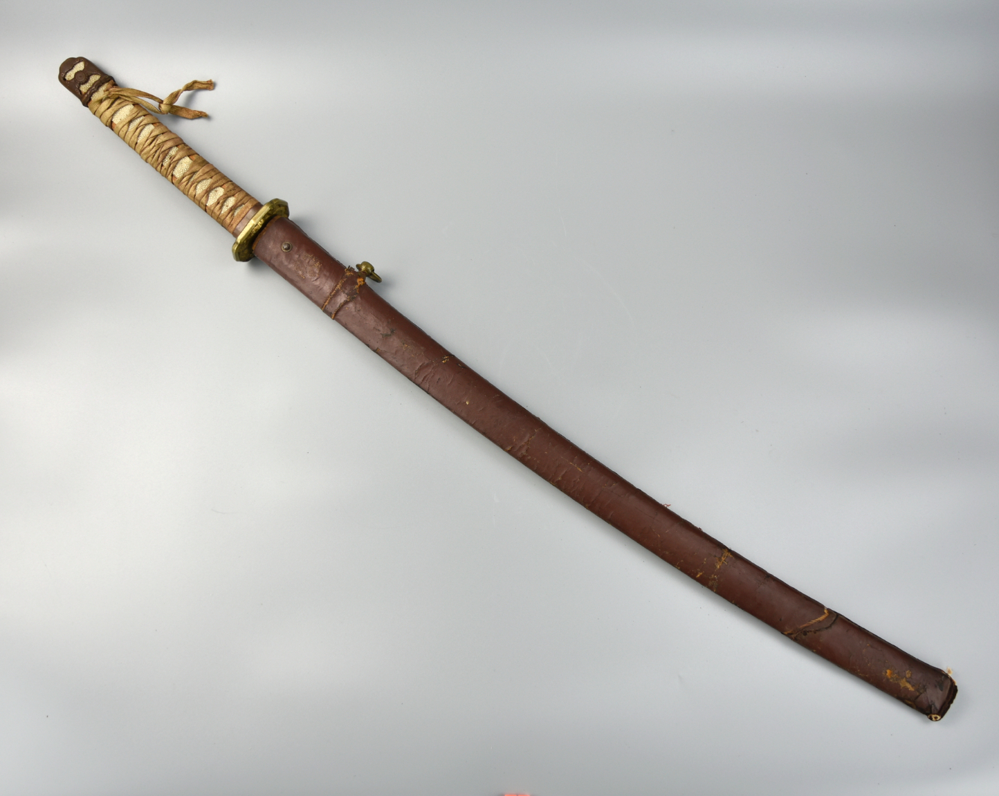 Appraisal: JAPANESE SAMURAI SWORD Japanese samurai sword including leather ray-skin wrapped