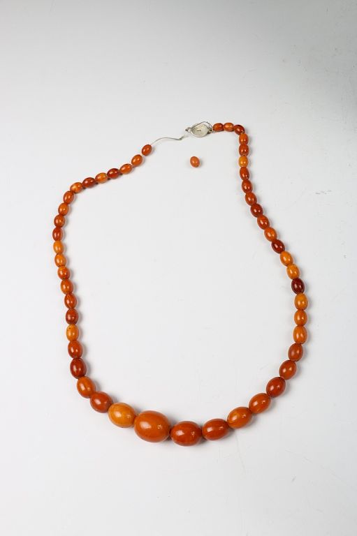 Appraisal: AMBER GRADUATED BEADED NECKLACE A strand of rare natural butterscotch