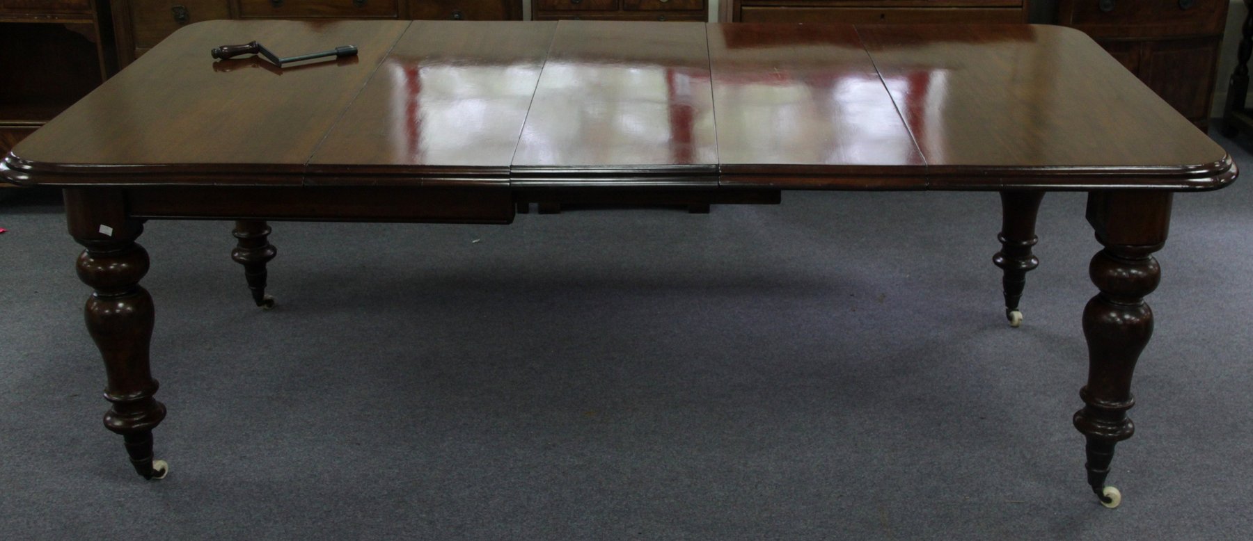 Appraisal: A Victorian mahogany extending dining table the top with moulded