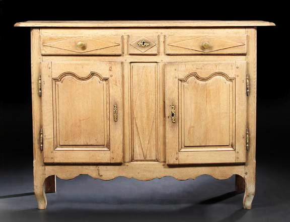 Appraisal: French Provincial Oak Buffet late th century the canted rectangular