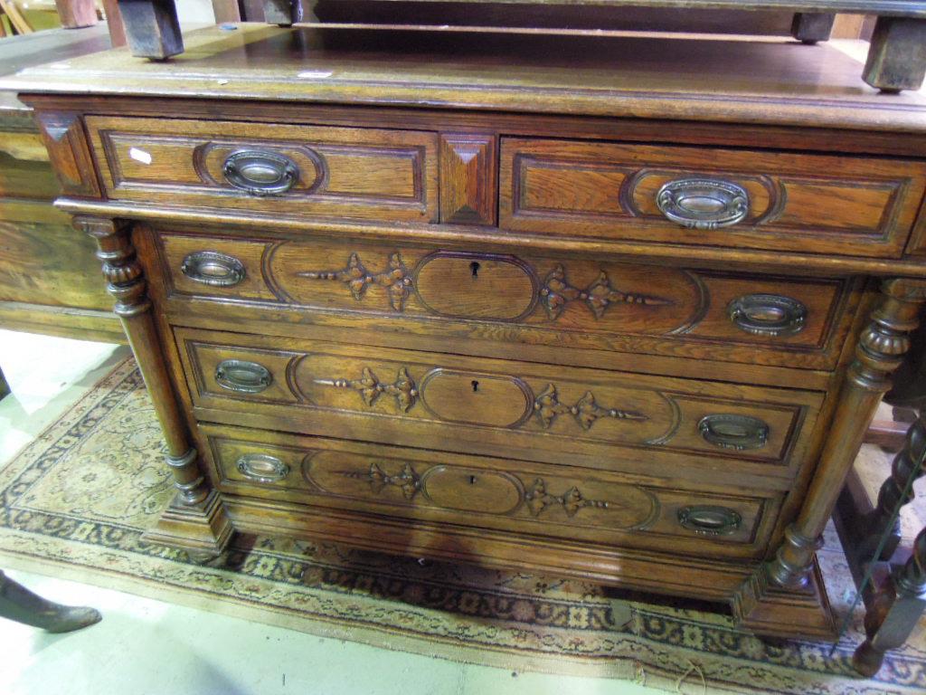 Appraisal: A continental oak commode fitted with arrangement of three long