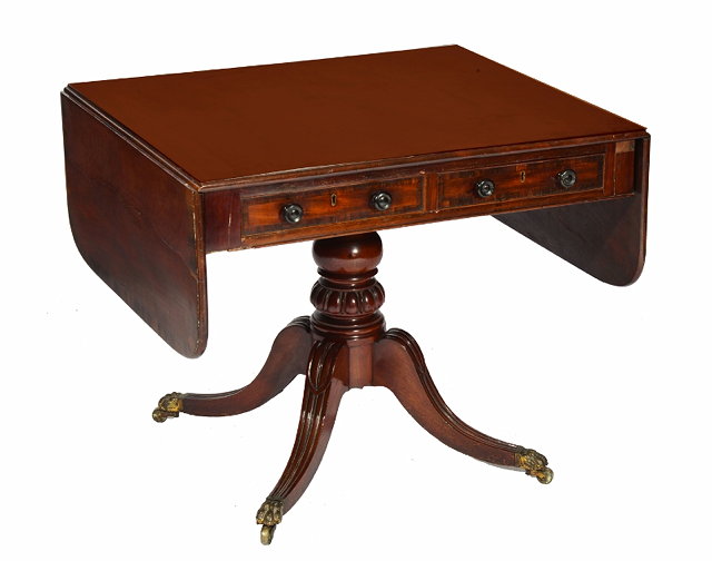 Appraisal: A REGENCY RECTANGULAR MAHOGANY SOFA TABLE the top with a