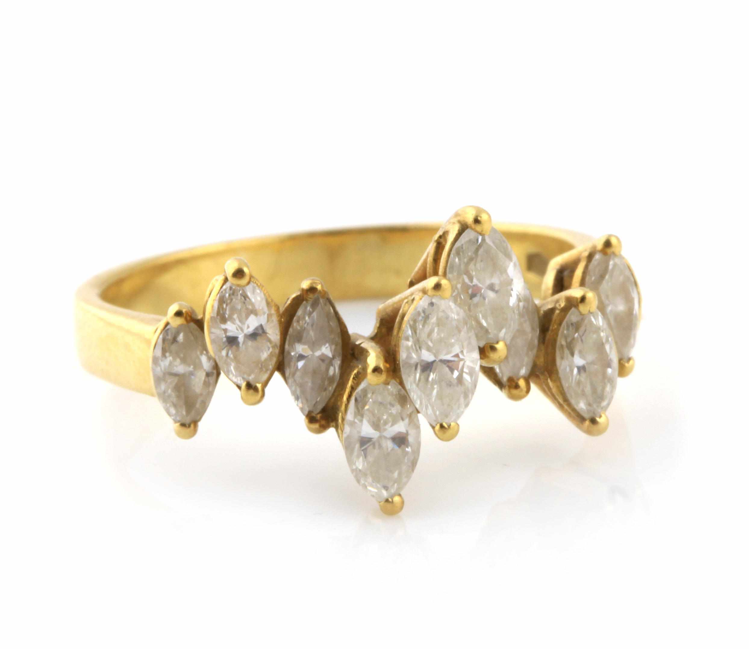 Appraisal: A diamond and k gold ring featuring nine marquise-shaped diamonds