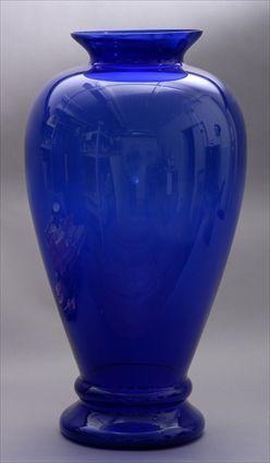 Appraisal: LARGE BLUE GLASS VASE The ovoid bowl with everted rim