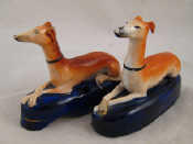 Appraisal: A pair of Staffordshire seated greyhounds circa each measuring approx