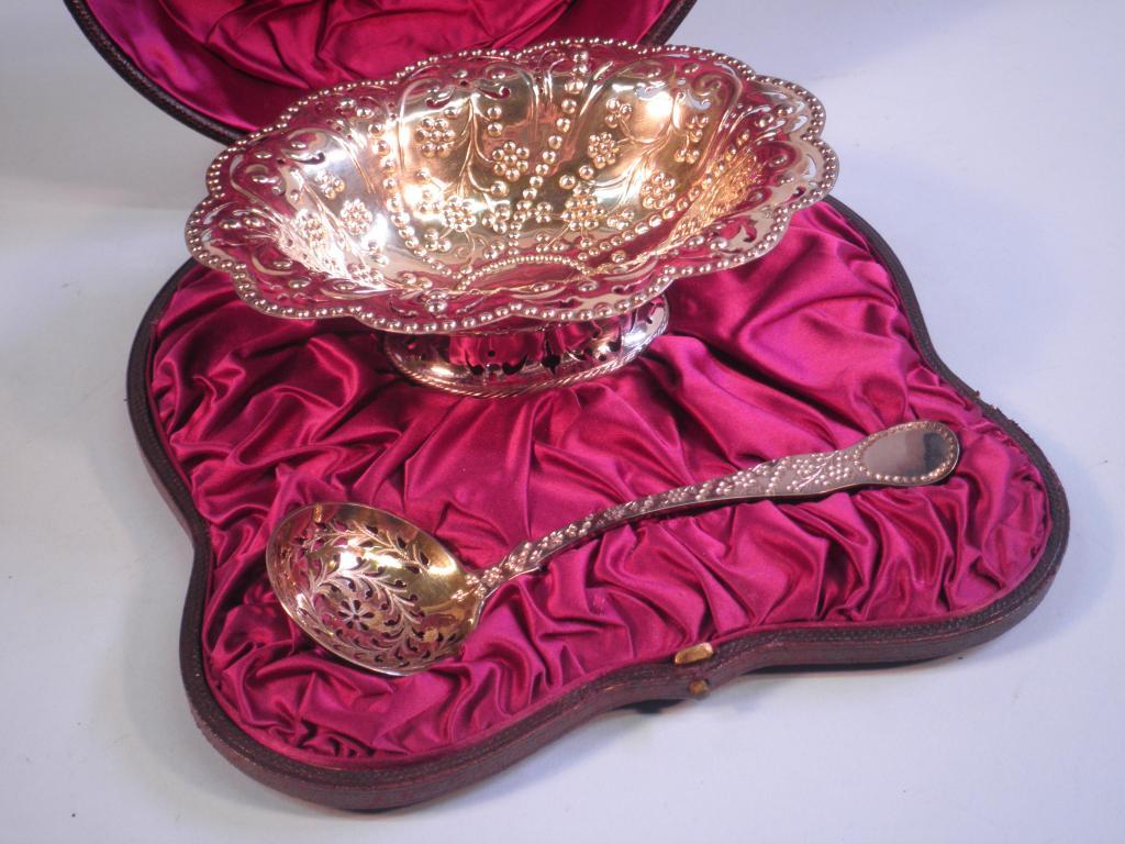 Appraisal: A Victorian silver gilt sugar bowl and sifter spoon each